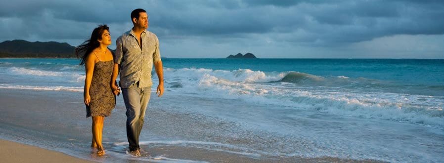 Honeymoon couple at sunset by the water
