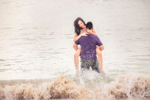 Honeymoon portrait with waves in the background