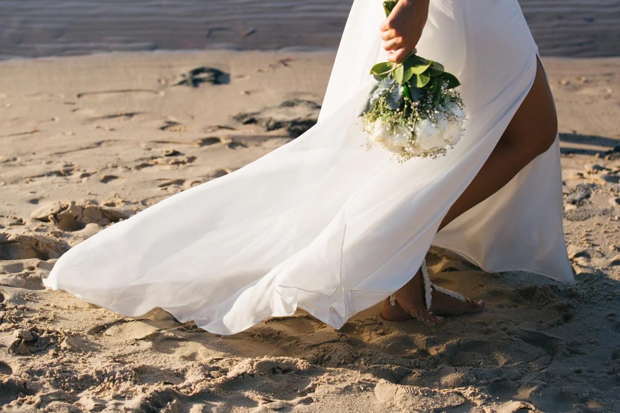 Honeymoon Island beach wedding setup with chairs and arch