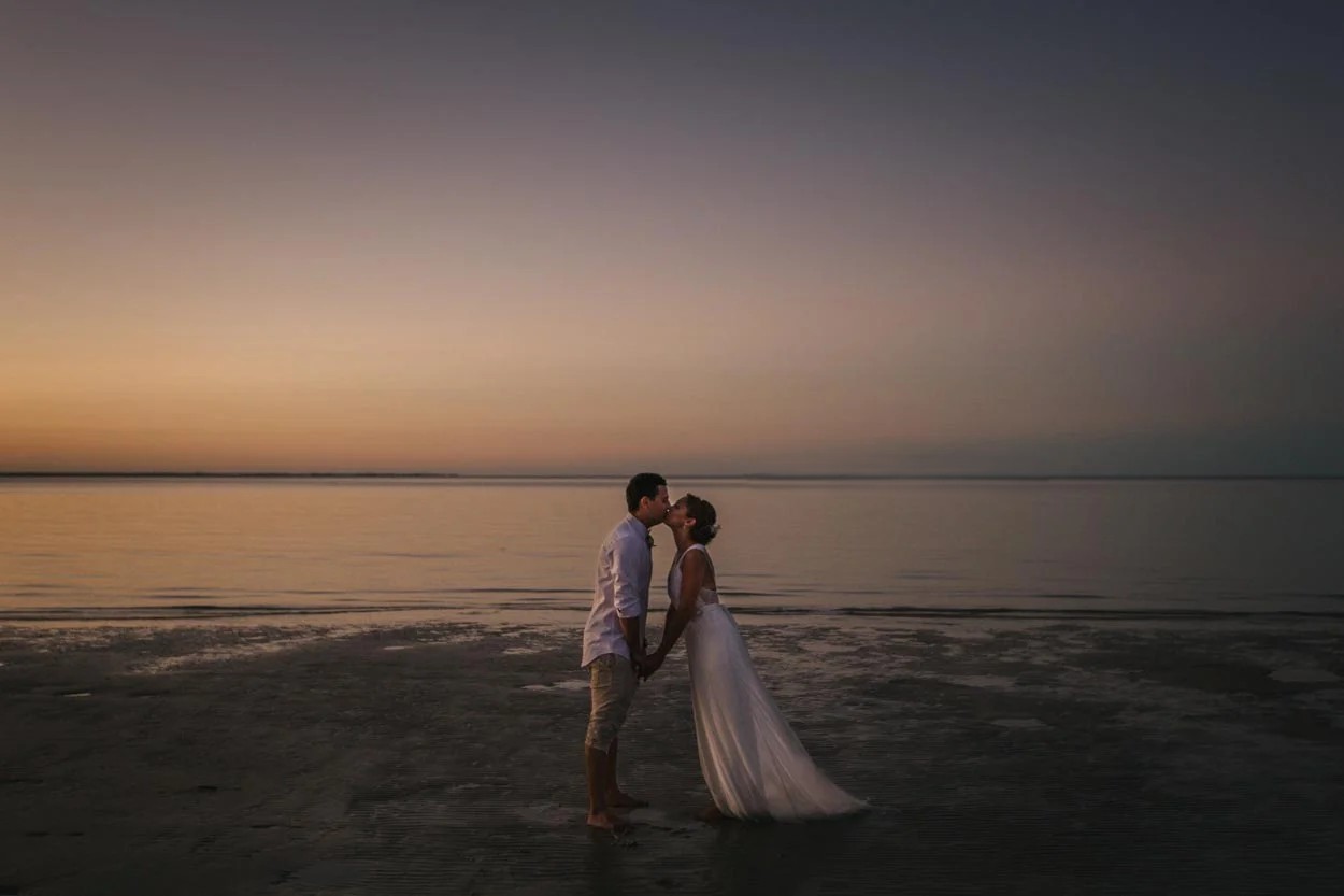Newlyweds celebrating at Honeymoon Island beach wedding