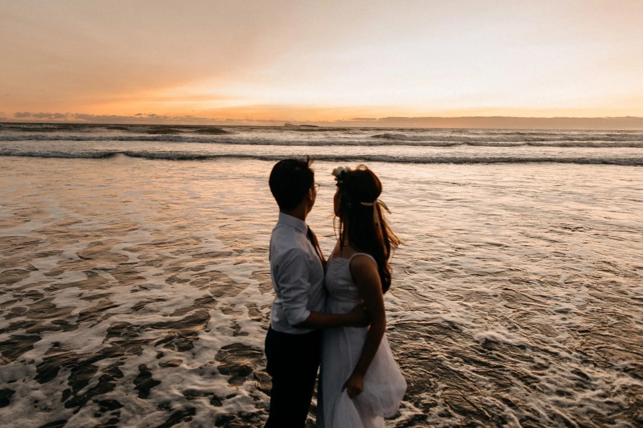 Wedding couple portrait on Clearwater Beach with golden sunset