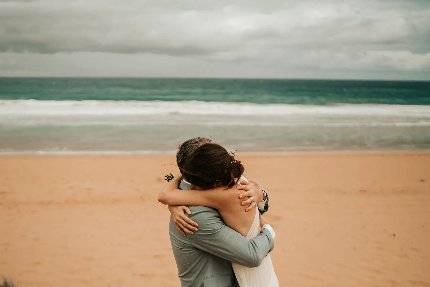Bean Point Beach ceremony setup with Gulf Coast backdrop