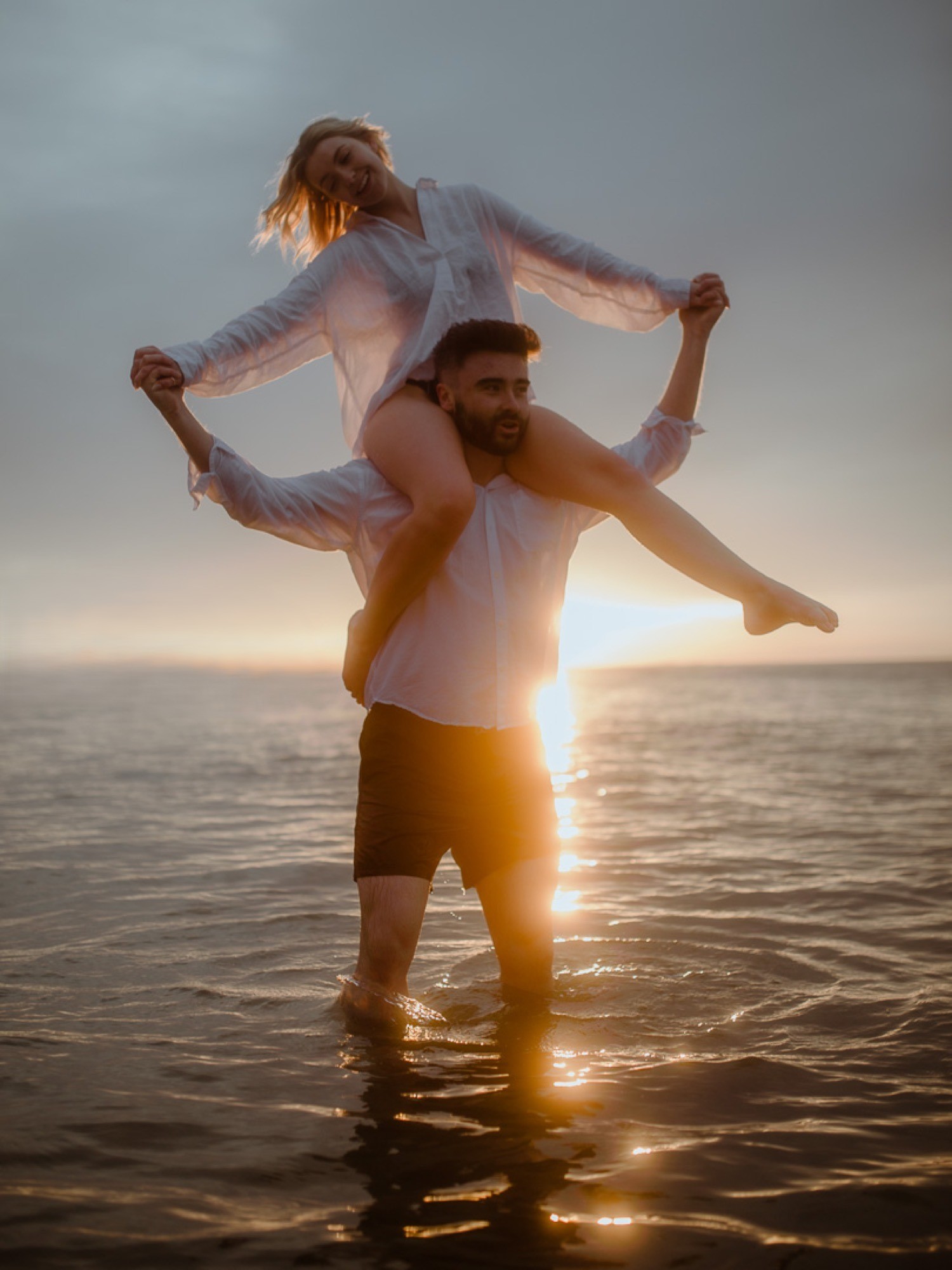 Vanessa and James honeymoon stroll on the beach