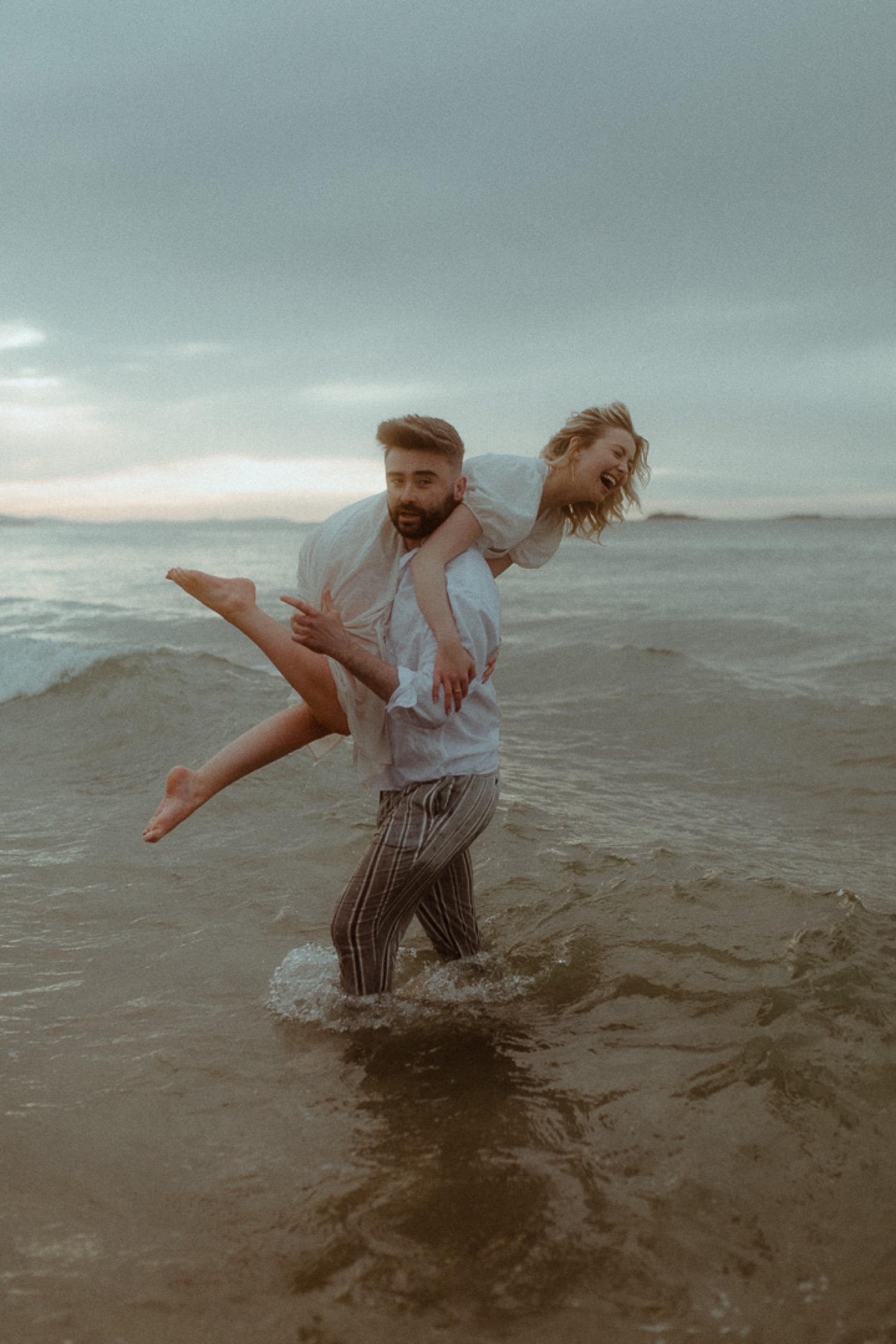Couple honeymoon photos on Anna Maria Island beach