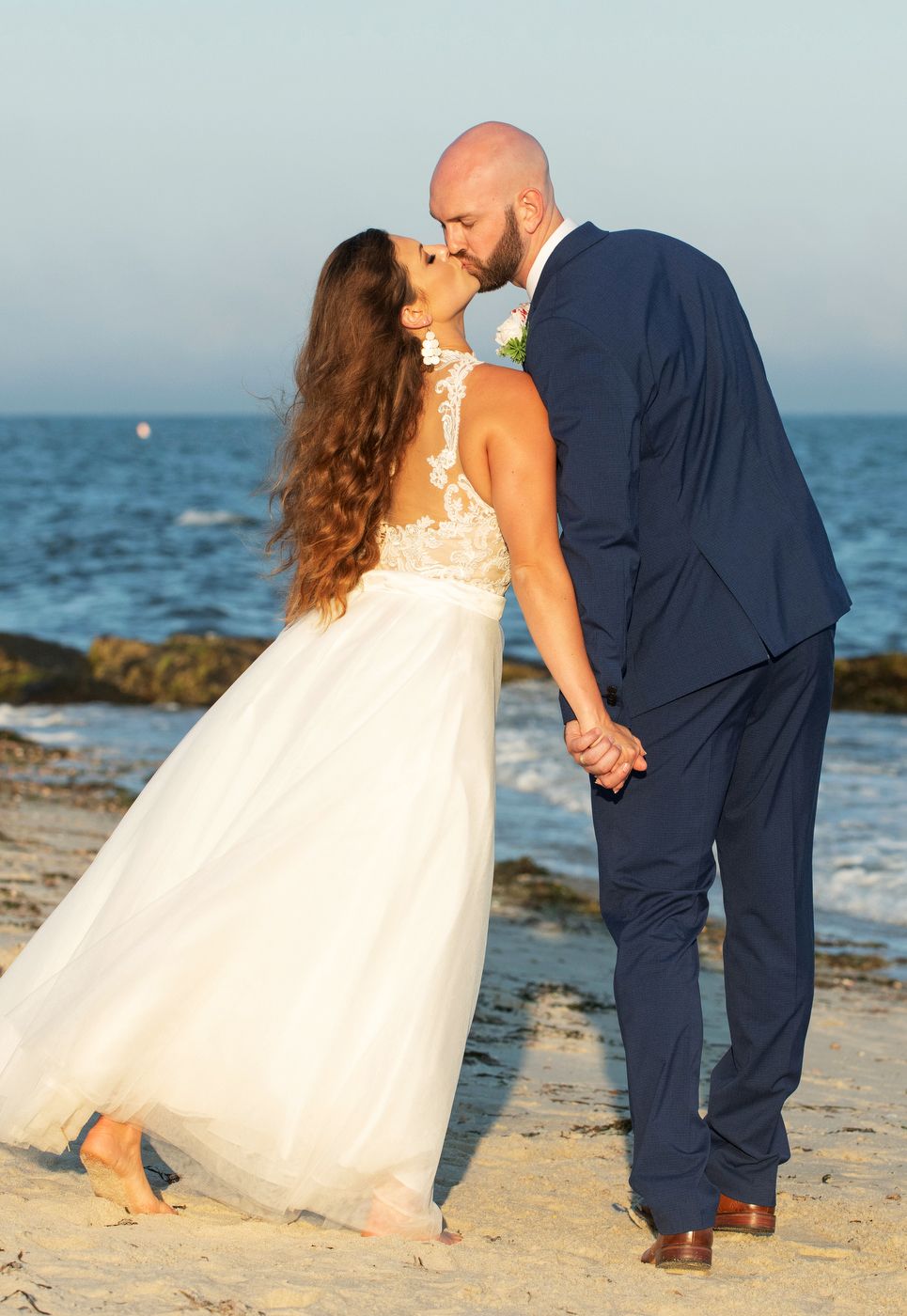 Relaxed coastal wedding moment on Upham Beach