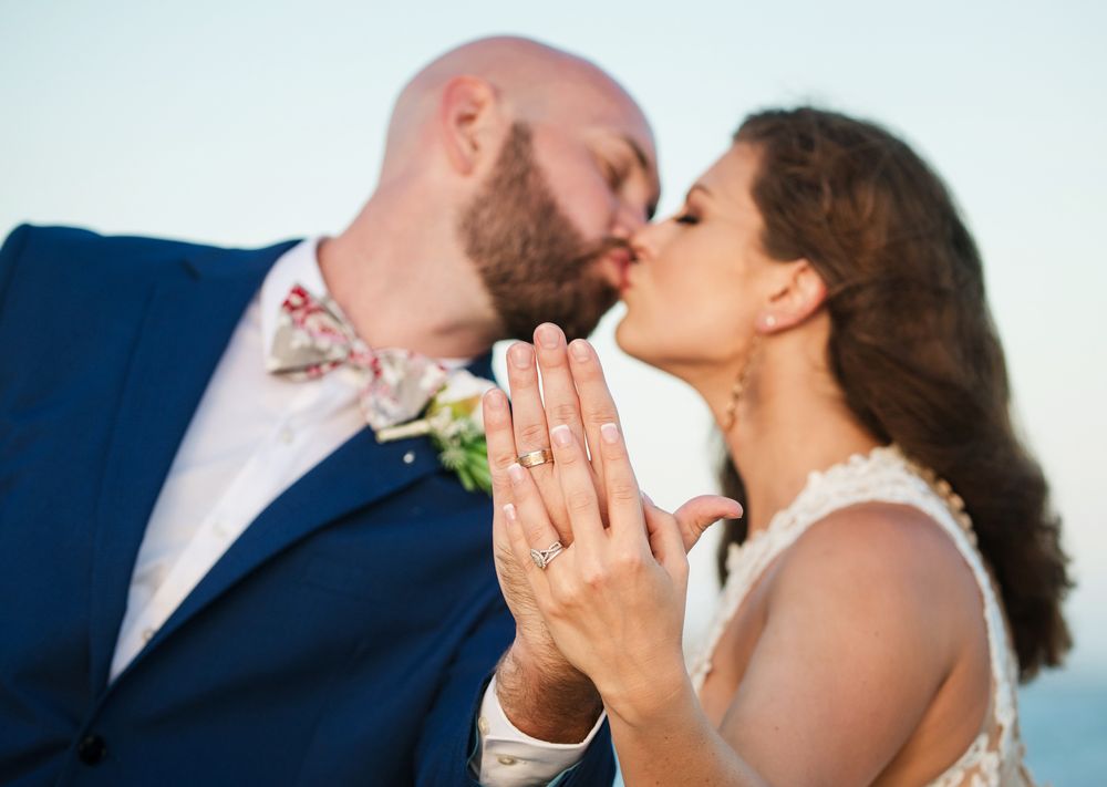 Final shoreline portrait of newlyweds at Upham Beach